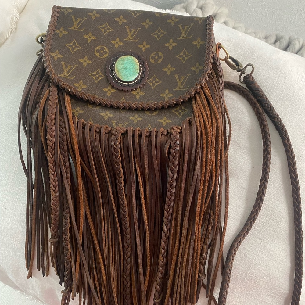 Stunning Authentic LV with turquoise buckle and braiding detail